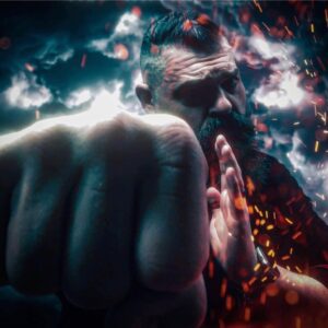 Bearded Man punching forward with dramatic lighting.
